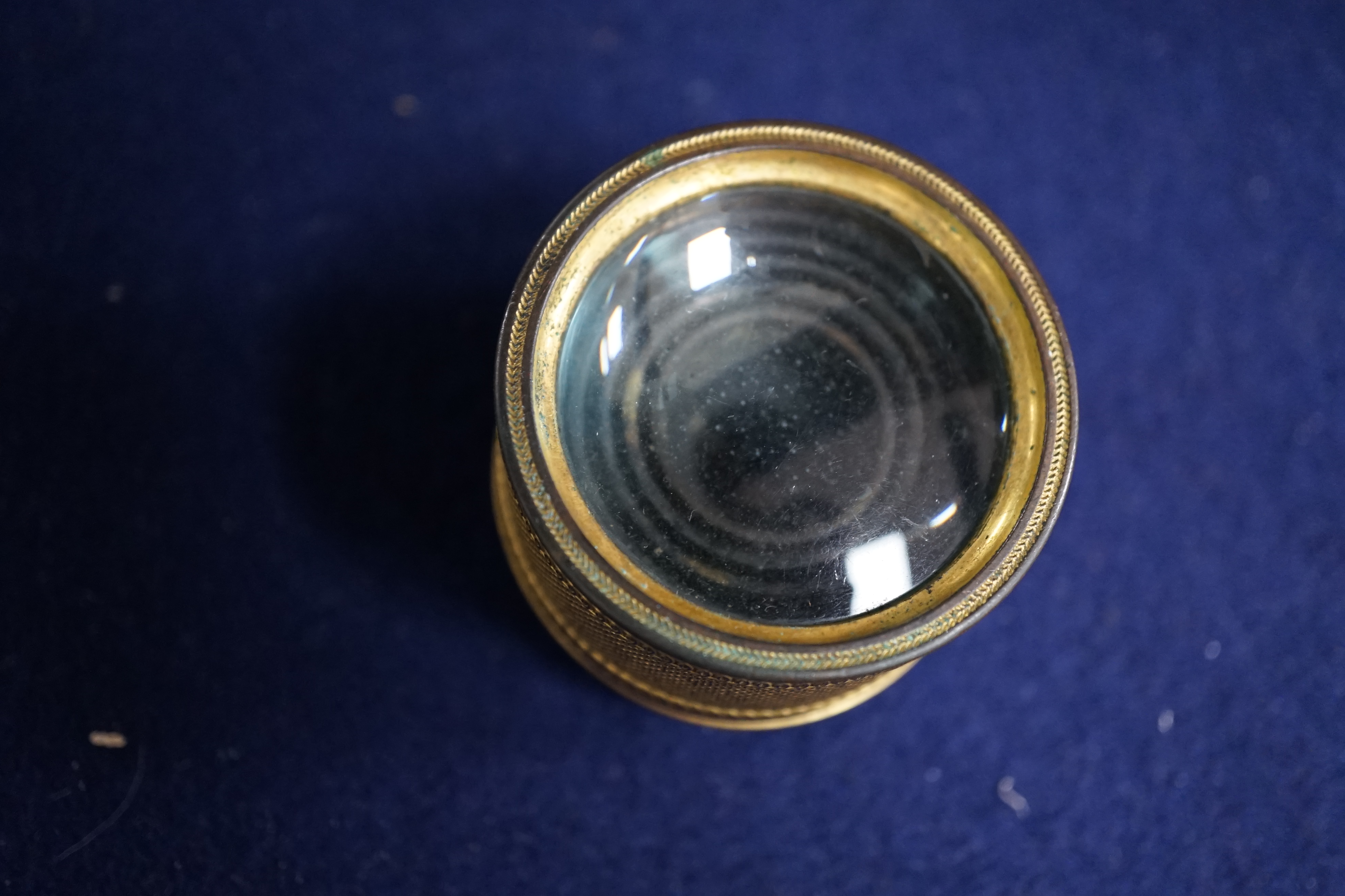 A 19th century gilt brass six drawer monocular telescope by Dollond, London, 10cm fully extended. Condition - fair, some wear to gilt finish.